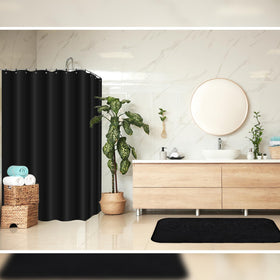 Hosuly waterproof black shower curtain helps contain splashes.