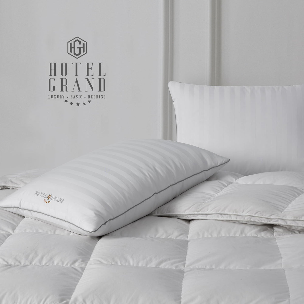 Hotel Grand pillows arranged on bed illustrate versatile night-long support for multiple sleep positions.