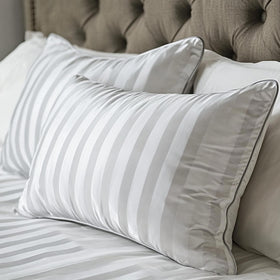Hotel Grand White Luxury Pillow close-up reveals fluffy feather-down fill for cloud-like comfort.