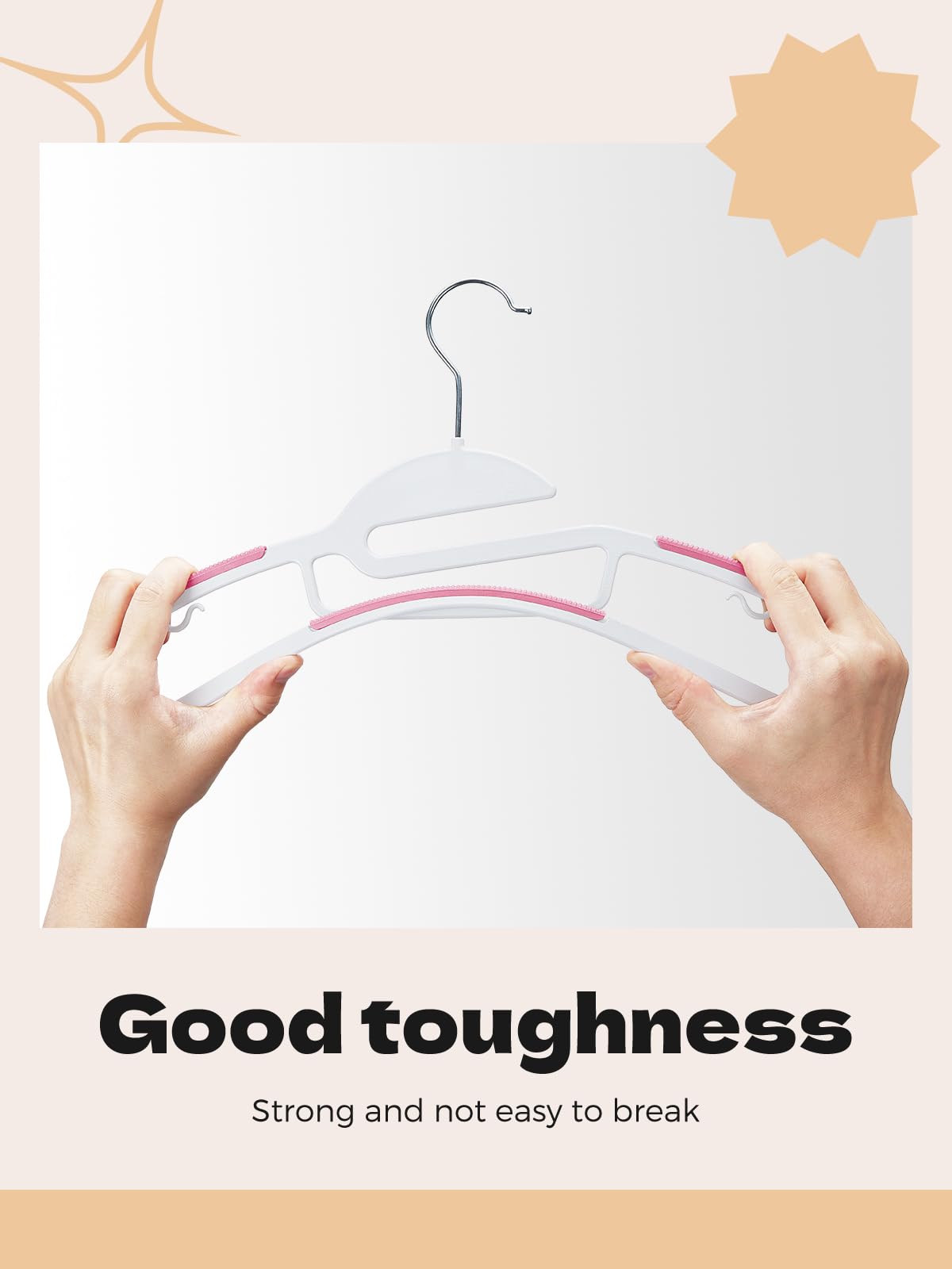 House Day pink hanger features non-slip pads to keep garments in place.