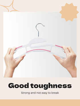 House Day pink hanger features non-slip pads to keep garments in place.