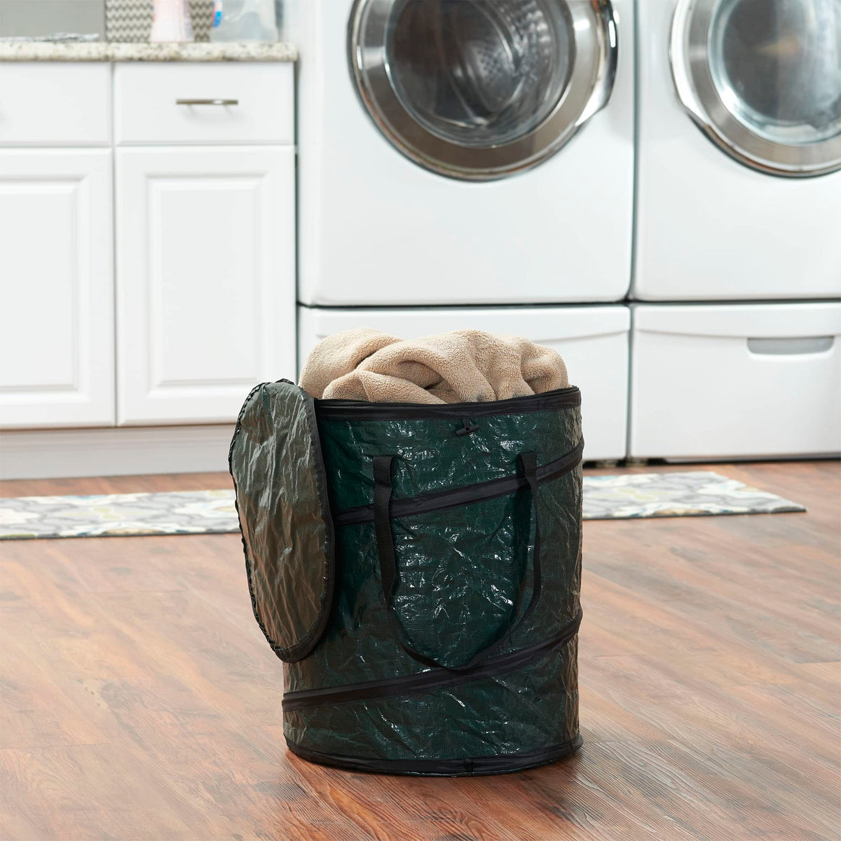 Household Essentials pop-up hamper with zippered top for secure storage during travel.