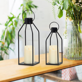 HPC Decor lantern on fireplace mantle adds warm flicker for cozy evenings.