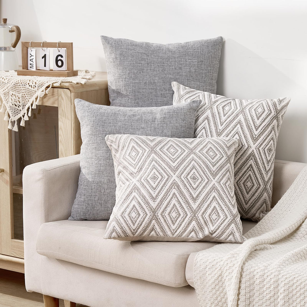 HPUK 17x17 grey pillow cover on bed, enhancing bedroom style