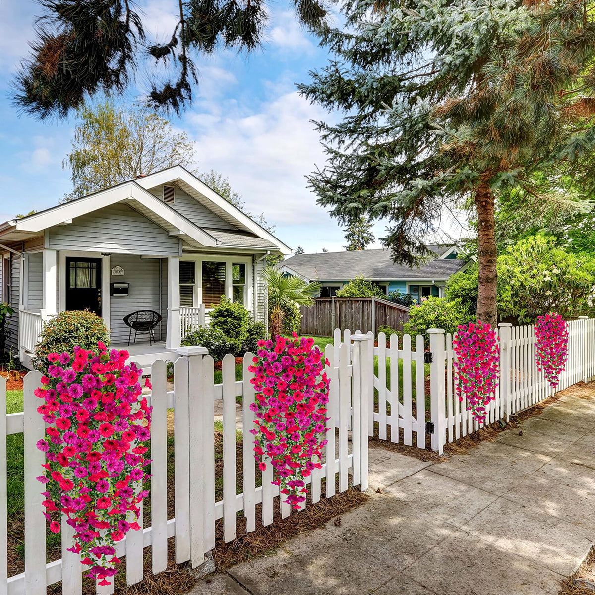 Hrobek outdoor porch decor uses waterproof faux greenery for year-round charm.