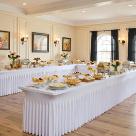 Htper baby shower buffet tables appear tidy with easy slide-on coverage.