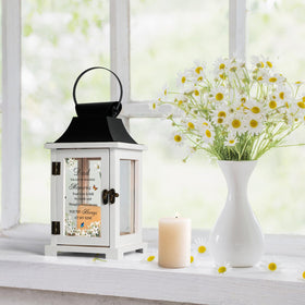 HugMemories lantern with glass sides lets candlelight shine clearly across room.