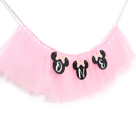HUHJRUAR Mouse One banner serves as a photo backdrop for first birthday memories