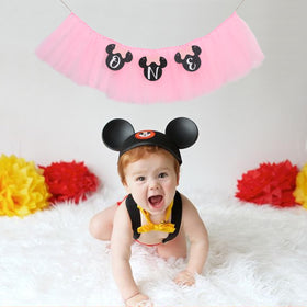 HUHJRUAR pink high chair banner draped for celebrations and photo moments