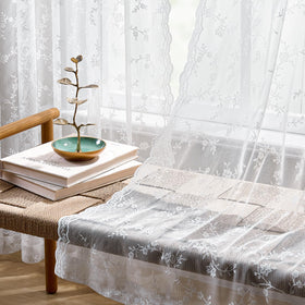 HushLoom lace curtain demonstrates gentle light filtering in a bright room.