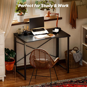Huuger desk folds flat for easy storage behind a door