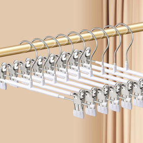 HWAJAN pants hangers with clips secure trousers with a non-slip grip in a tidy closet.