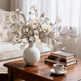 Hyeflora long magnolia stems create dramatic centerpieces for events.