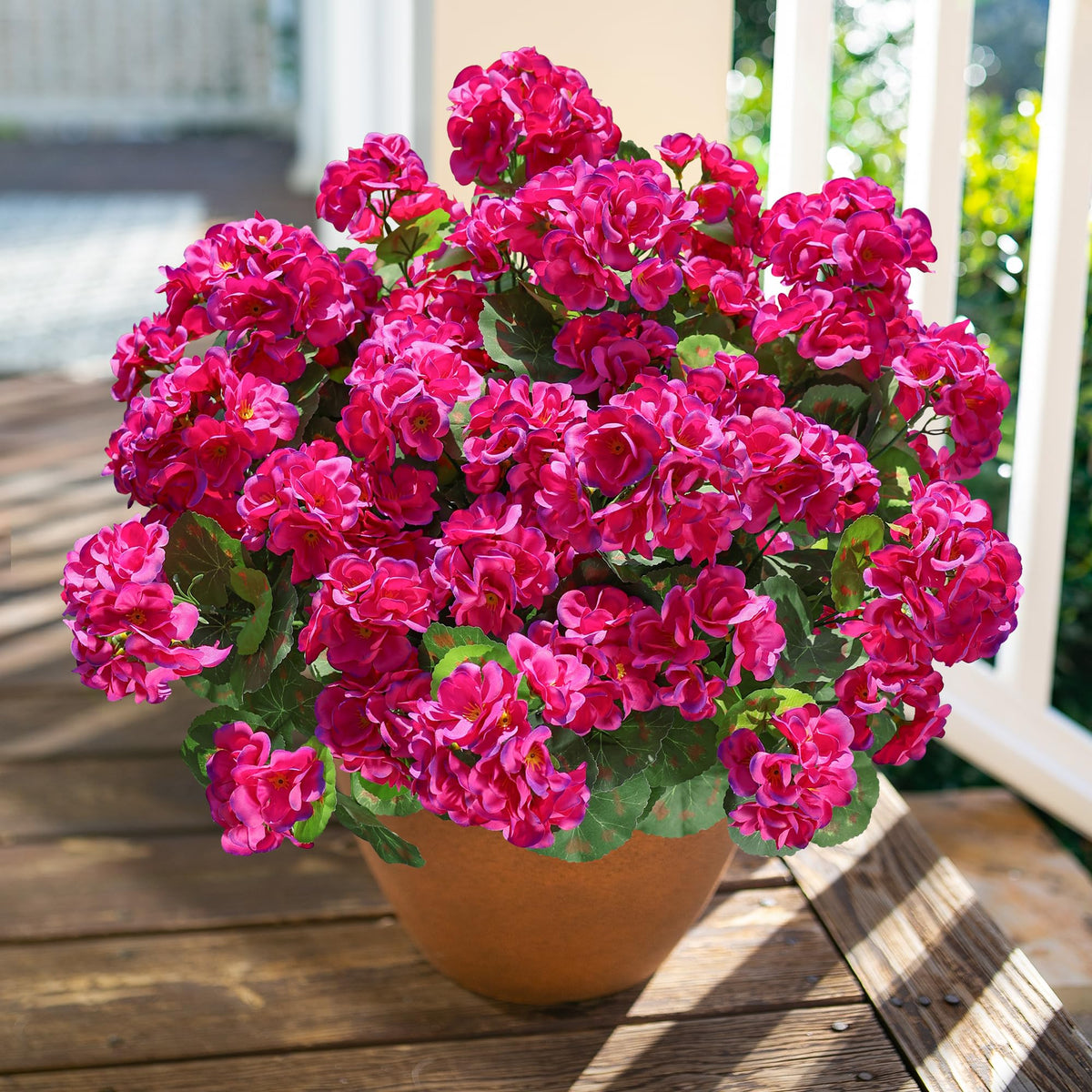 HyeFlora windowsill display with silk geraniums stays fresh-looking.
