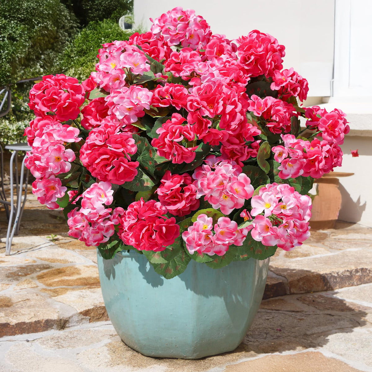 Silk geraniums with real-touch leaves for natural home styling.