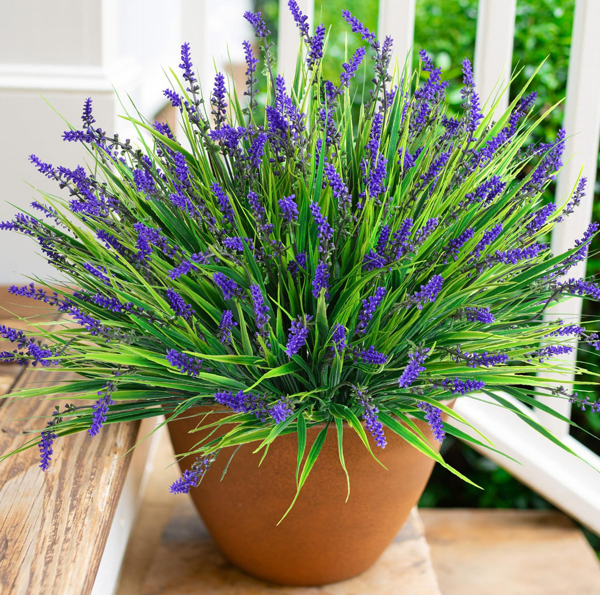 HyeFlora wide-angle garden setup with faux grasses framing a patio.