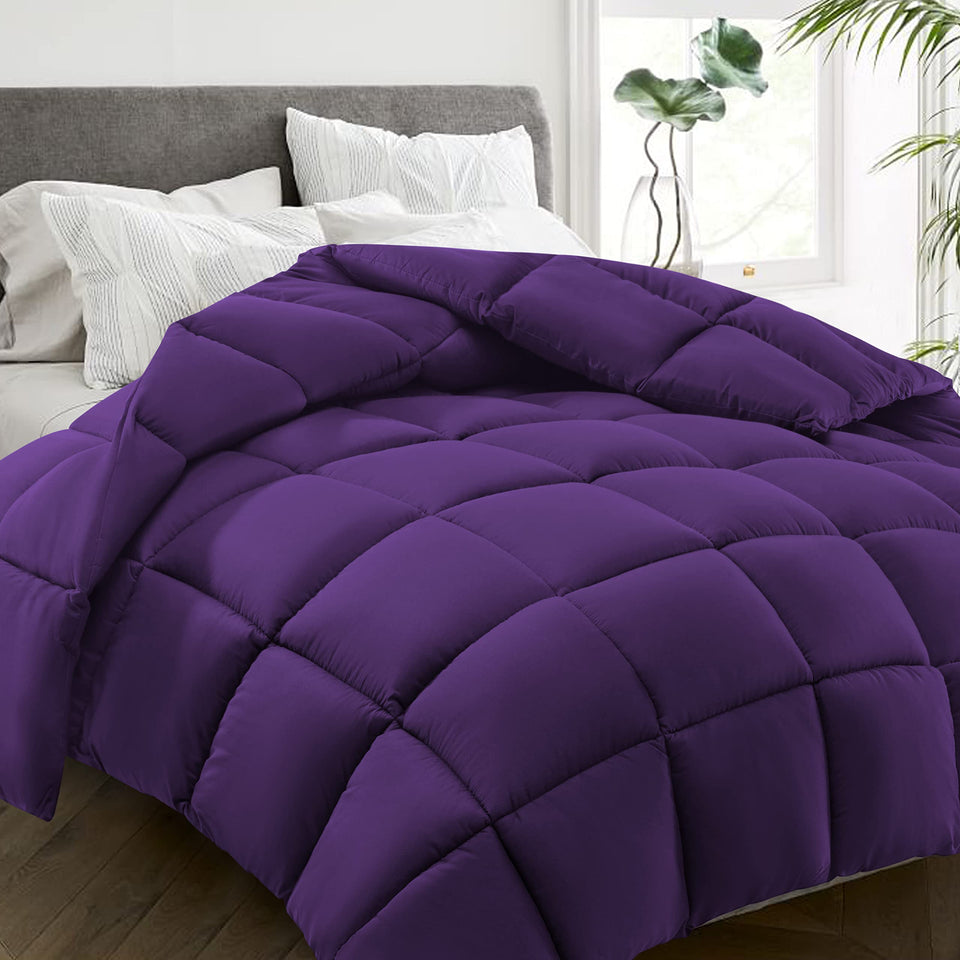 HYLEORY all-season queen comforter on bed with soft purple fabric for year-round comfort.