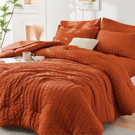 HYMOKEGE Burnt Orange queen comforter seersucker texture showing wrinkle resistance and cozy feel