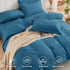 HYMOKEGE Teal Queen shams with modern seersucker accents.