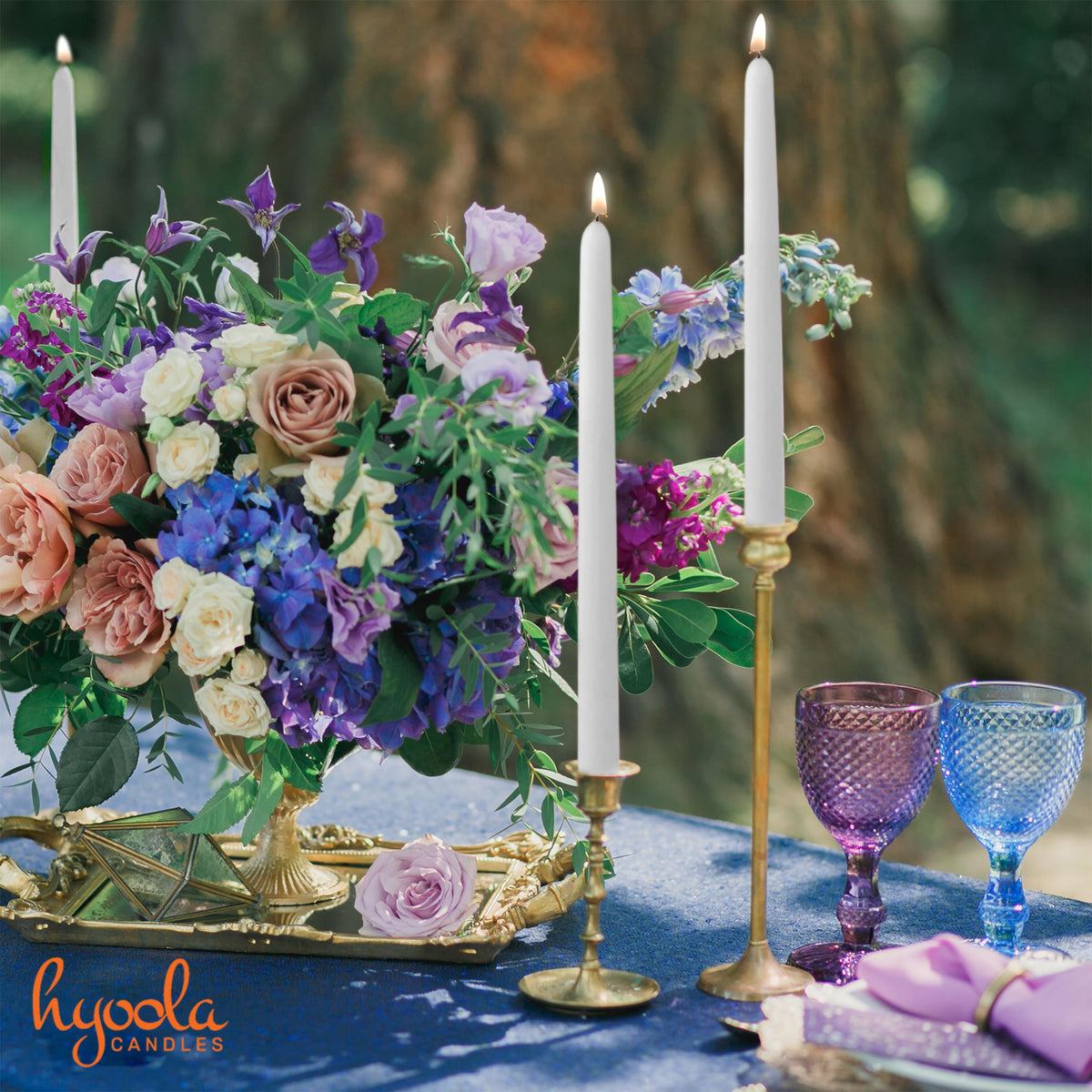 Hyoola tall taper candle on ballroom table showing clean burn.