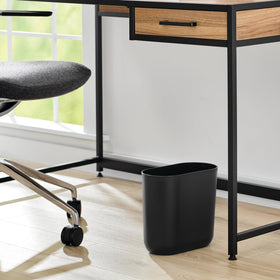 iDesign Cade Oval Trash Can is made of durable plastic for long-lasting use.