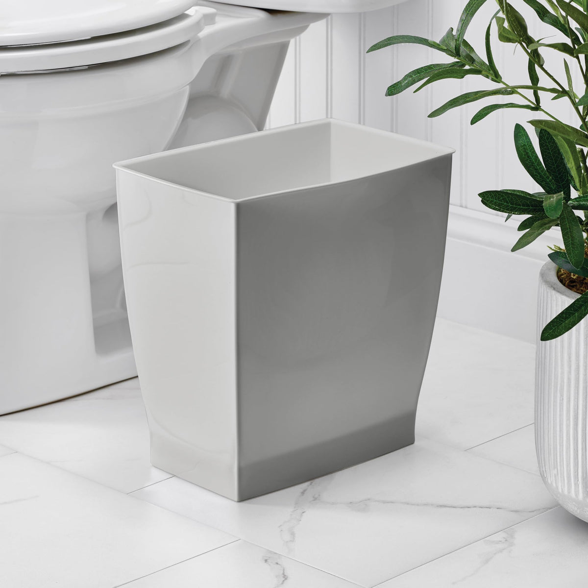 iDesign Mono Trash Can with a gray finish adds modern style to bathrooms, bedrooms, or offices.