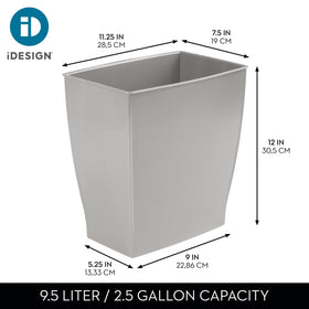 iDesign Mono Trash Can placed under a desk to keep surfaces clear.