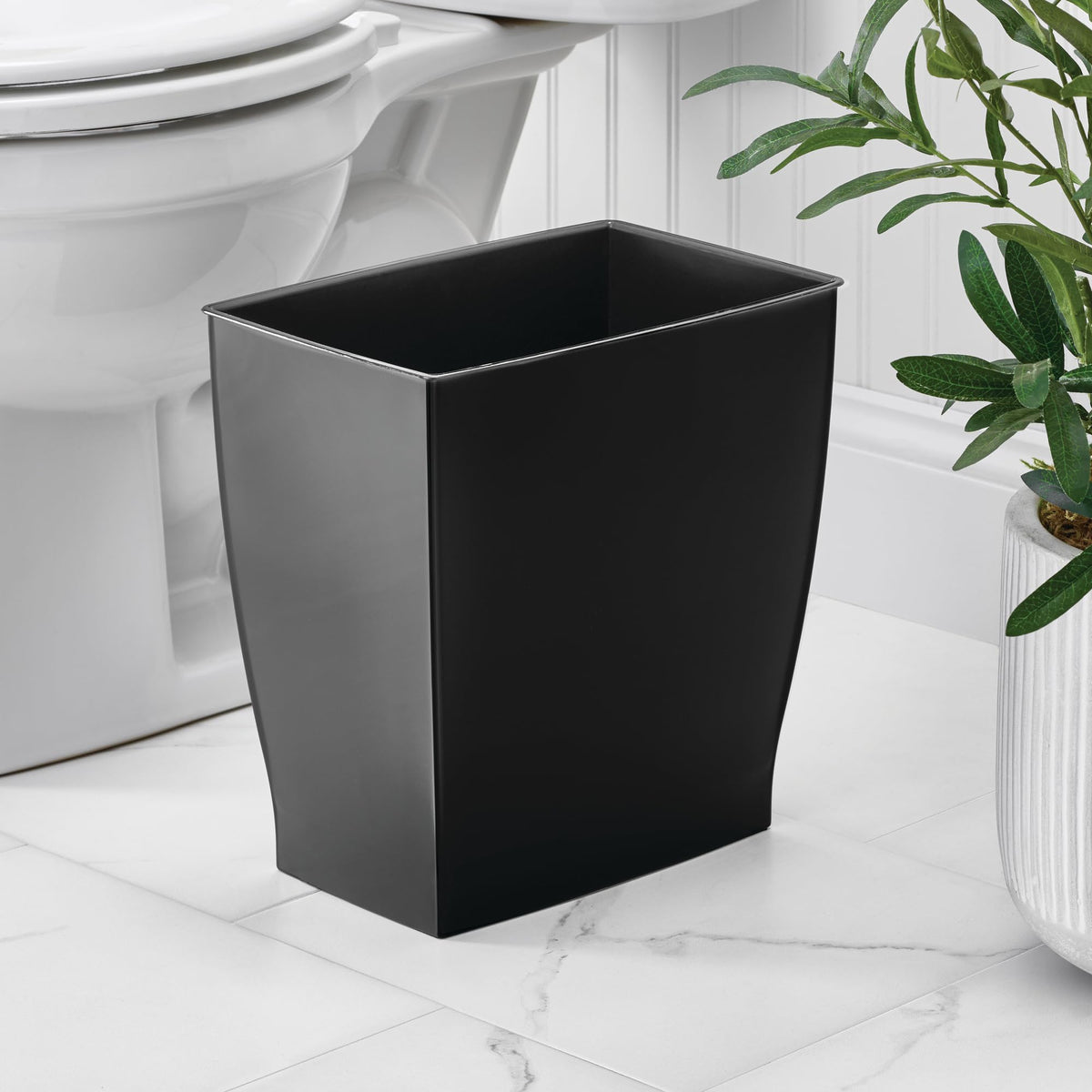 iDesign Mono trash can under desk demonstrates discreet placement in compact rooms