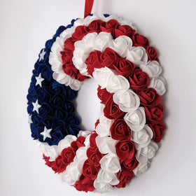 Idyllic americana wreath on wall complements blue-red-white theme.