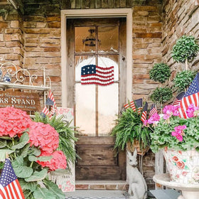 Idyllic hemp rope detail adds rustic texture to patriotic wreath.