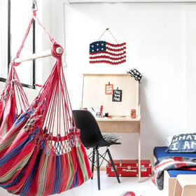 Idyllic white board base anchors the Independence Day wreath.