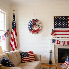 Idyllic large 22-inch wreath on garage door conveys grand outdoor presence