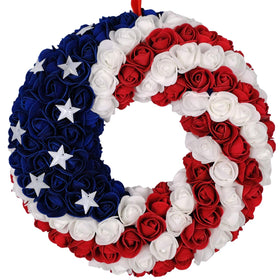 Idyllic patriotic wreath on front door with blue tones for festive curb appeal.