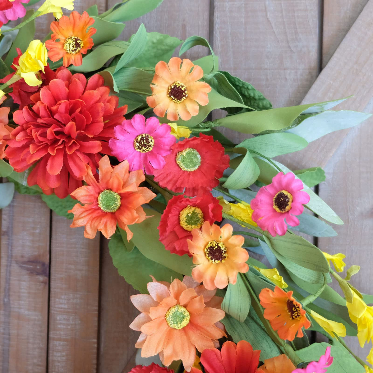 Idyllic summer decor wreath hanging on door adds instant charm.