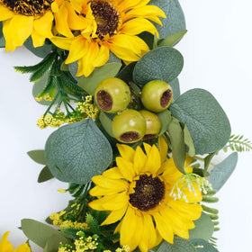 Durable artificial materials in Idyllic wreath resist fading for outdoor use.