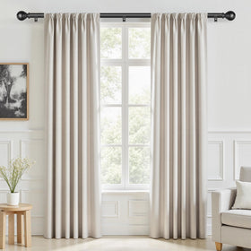 IFELS matte black finials on curtain rod for a modern look.