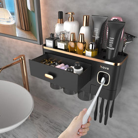 iHave toothbrush holder wall-mounted with toothpaste dispenser and 3 cups in black and gold—ideal for clutter reduction.