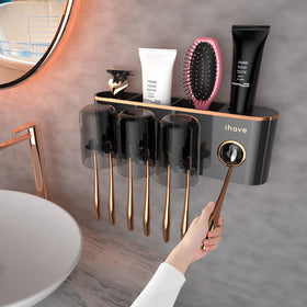 iHave toothbrush holder with toothpaste dispenser mounted on wall for easy access and tidy bathroom