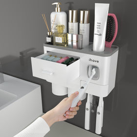 iHave wall-mounted toothbrush holder with tray and dispenser keeps surfaces tidy and organized.