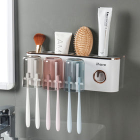 iHave wall-mounted toothbrush holders with toothpaste dispenser keep toothbrushes organized.