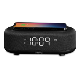 iHome iBTW112 wireless charger on nightstand powering a phone