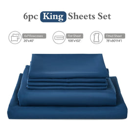 ILAVANDE navy blue king sheets on a bed under warm lighting show rich color and luxe texture.