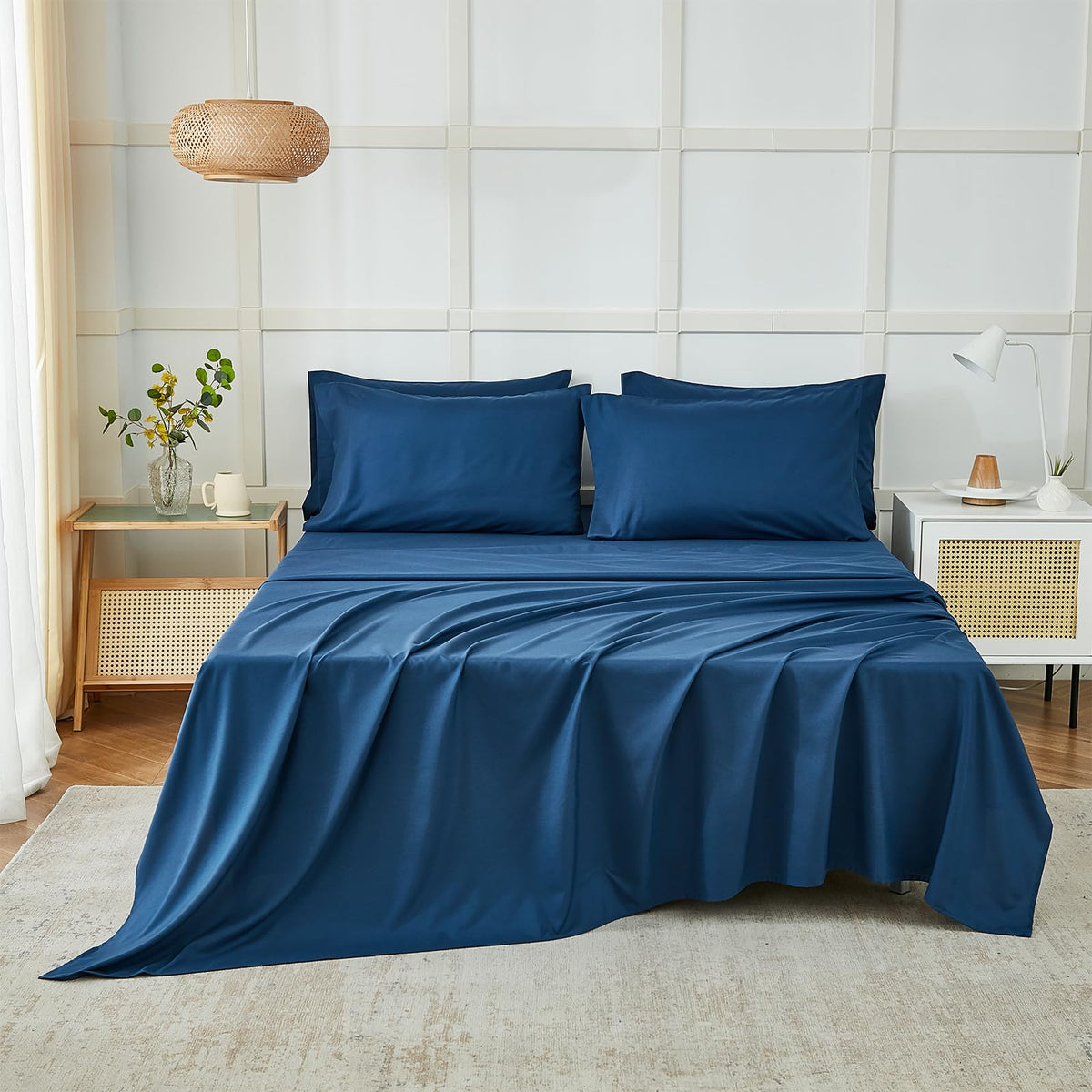 ILAVANDE navy blue king fitted sheet stretched over mattress highlighting deep pockets.