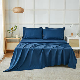 ILAVANDE navy blue king fitted sheet stretched over mattress highlighting deep pockets.