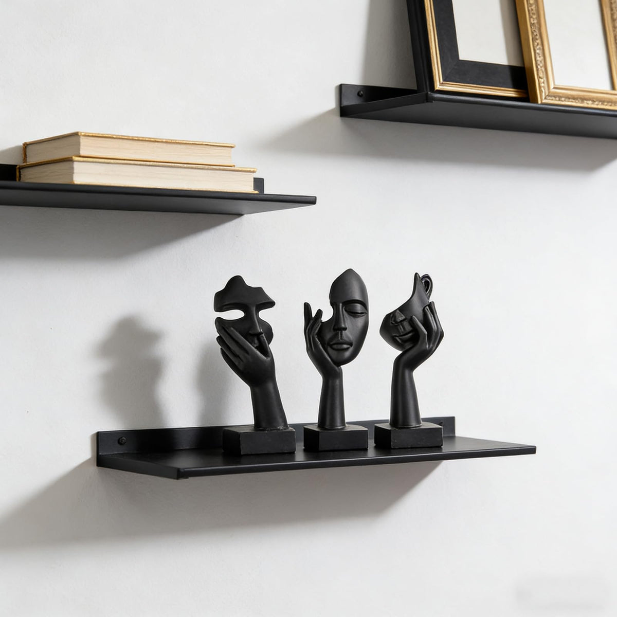oliruim thinker statue abstract face black gold center pose adds desk depth.