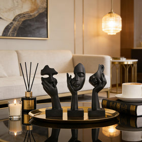oliruim thinker statues set dramatic posing 1 highlights bold abstract art on shelves.