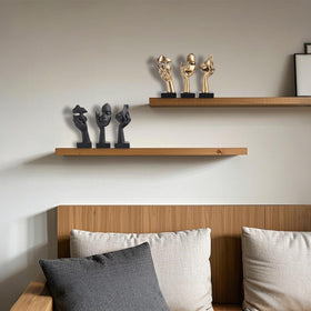 oliruim thinker bedside table figure adds contemporary flair.