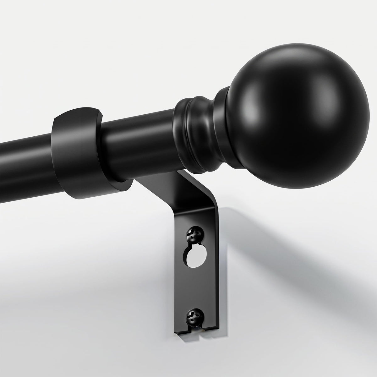 Immiehh black curtain rod with decorative finials for stylish window treatments.