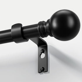 Immiehh black curtain rod with decorative finials for stylish window treatments.