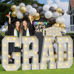 imprsv Grad 4ft light up letters arranged for a photo-ready graduation backdrop